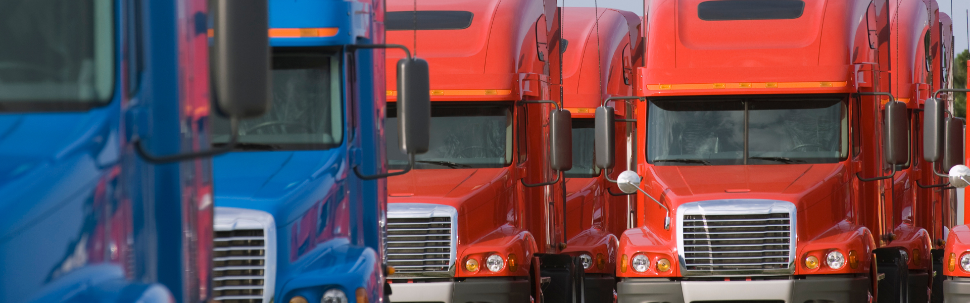 orange and blue semi trucks