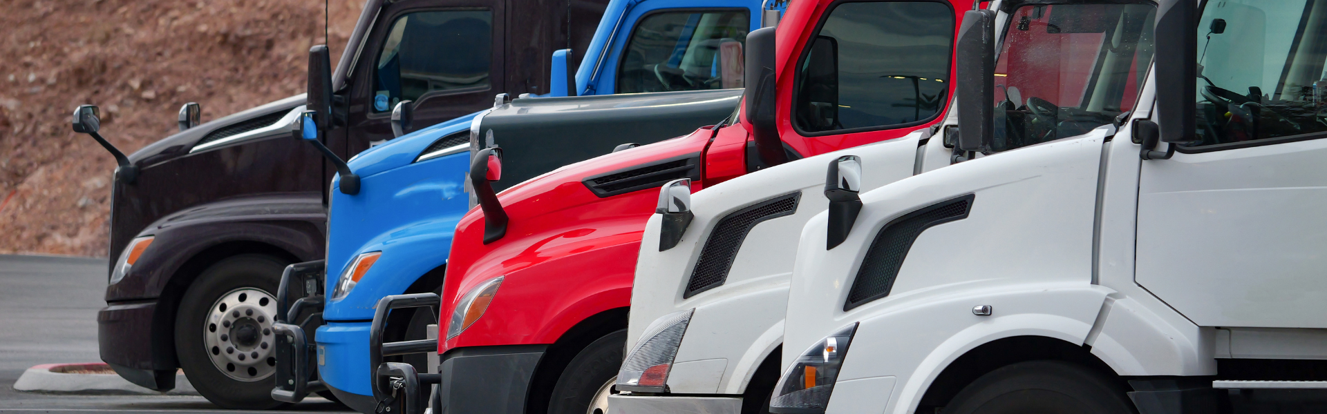parked semi trucks in varying colors