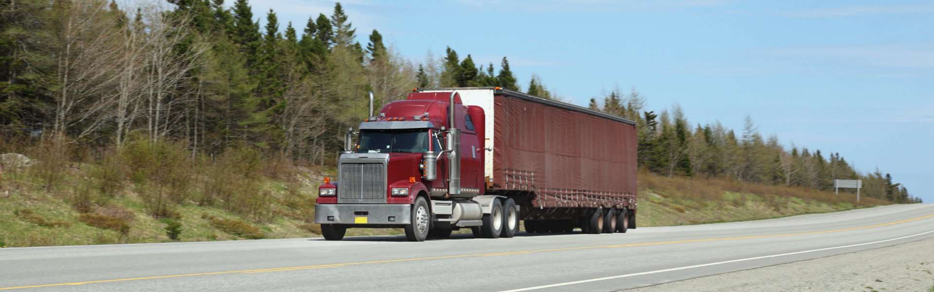 red semi truck on road