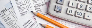 tax forms, calculator, pencils
