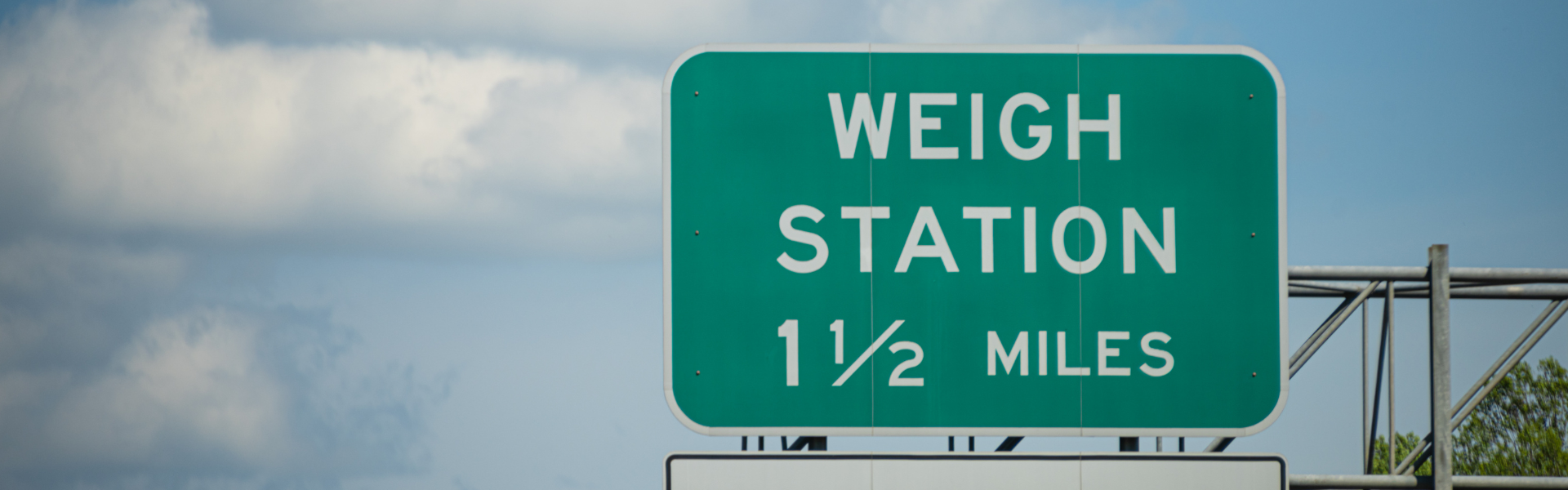 road sign for weigh station