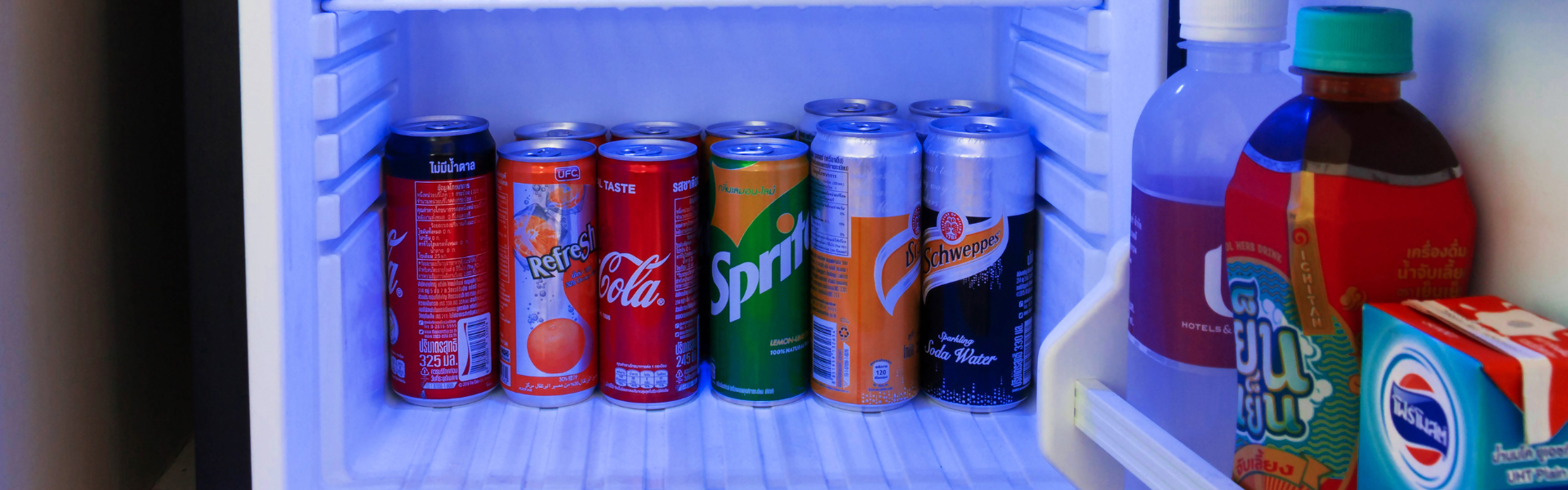 inside of a mini fridge filled with drinks
