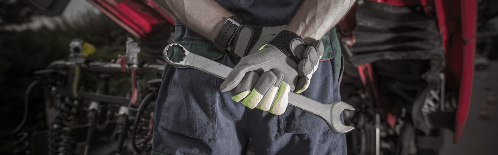 mechanic holding wrench