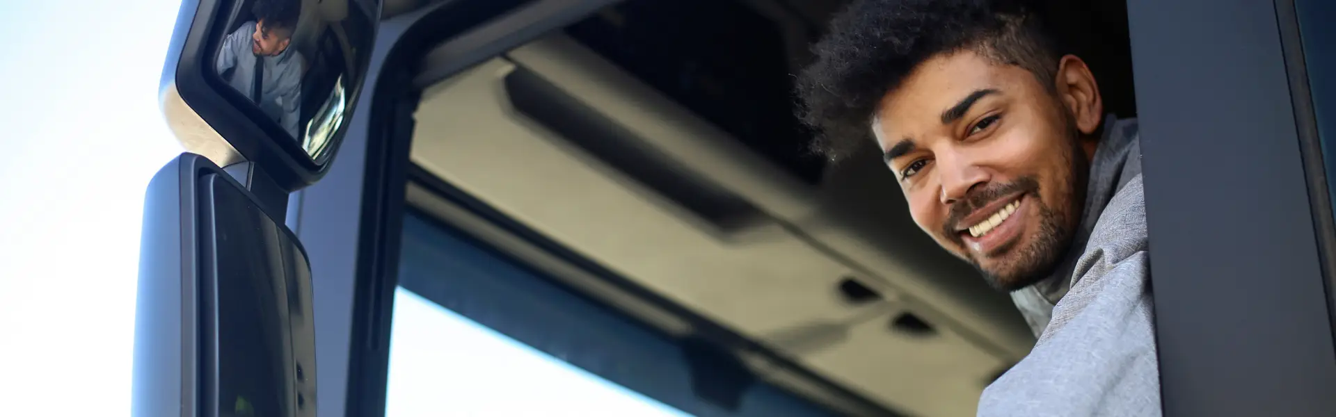 young black man driving semi truck