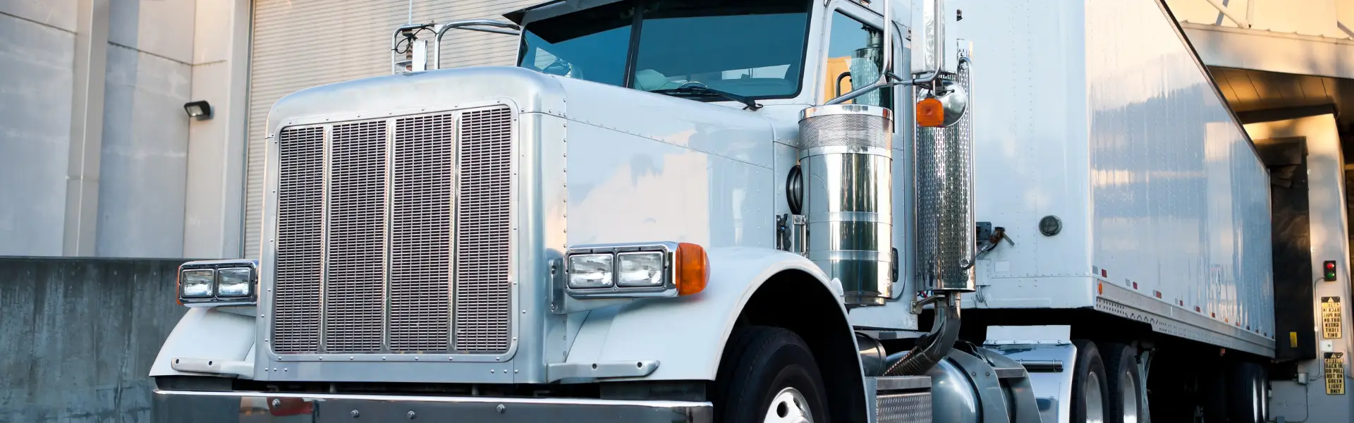 semi truck backed up to loading dock