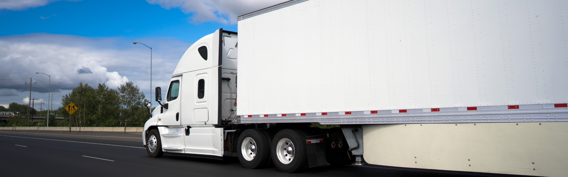 white semi truck with white trailer