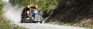 logging truck on gravel road