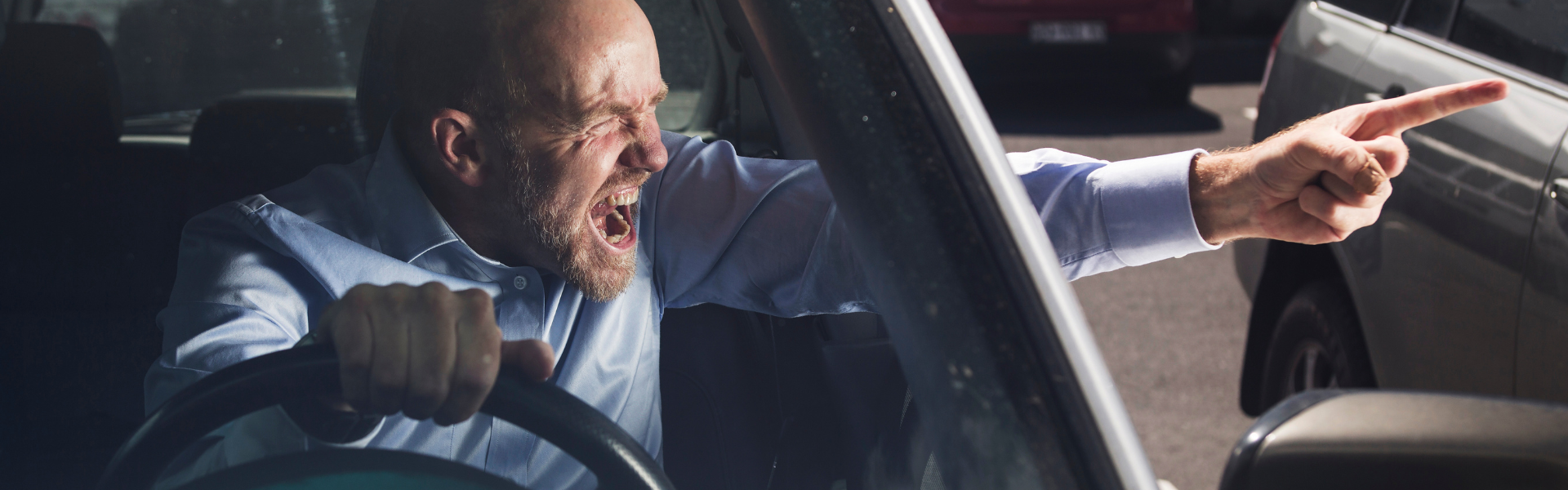 man in car with road rage