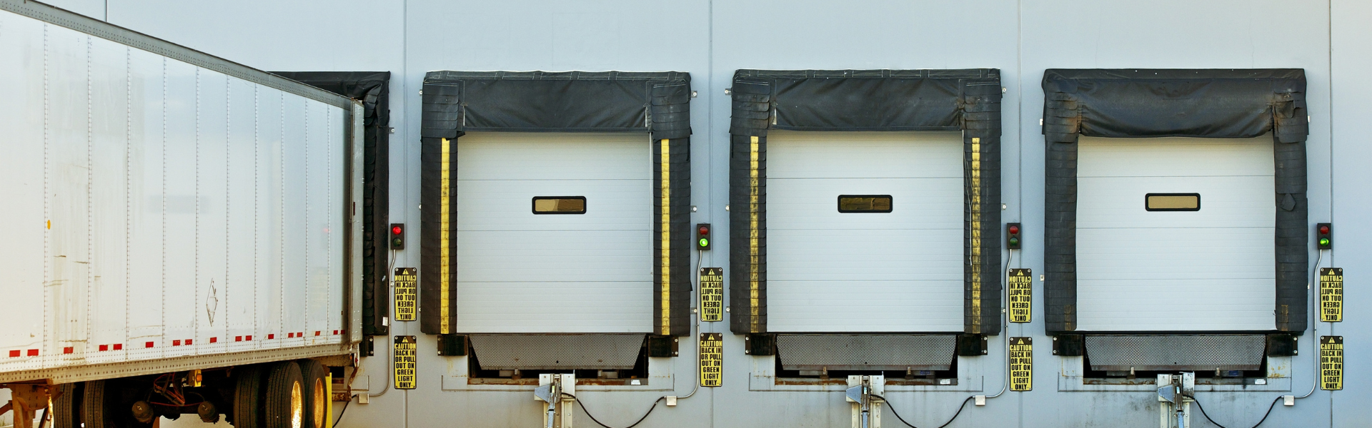 semi truck trailers in loading bays