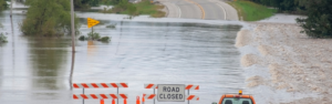 flooded road with road closed sign