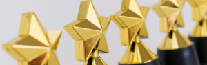 line of gold star trophies