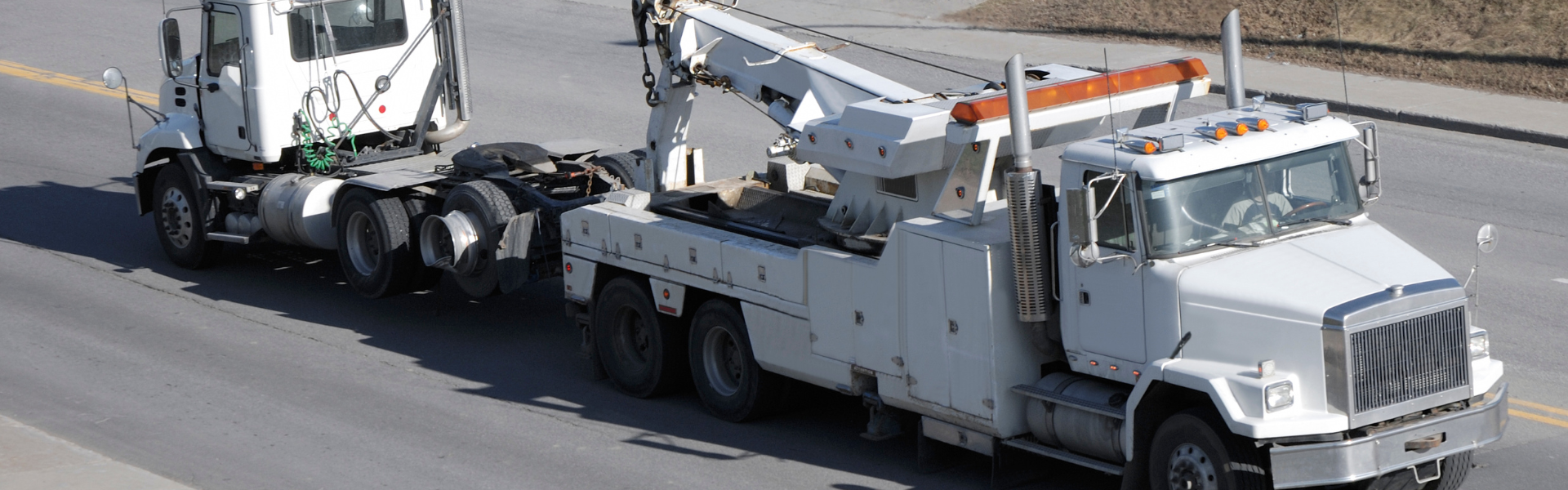 semi truck being towed