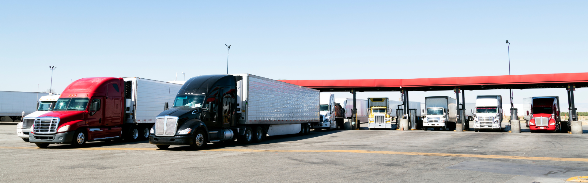 semi trucks at truck stop fuel island
