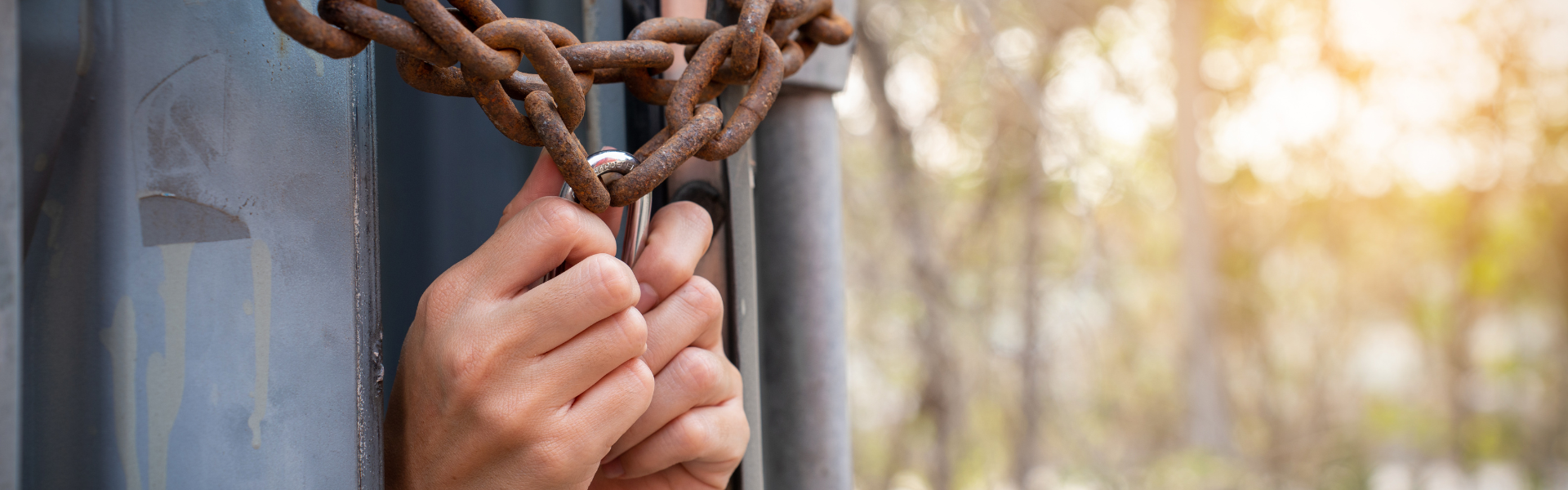 hands reaching out of chained trailer