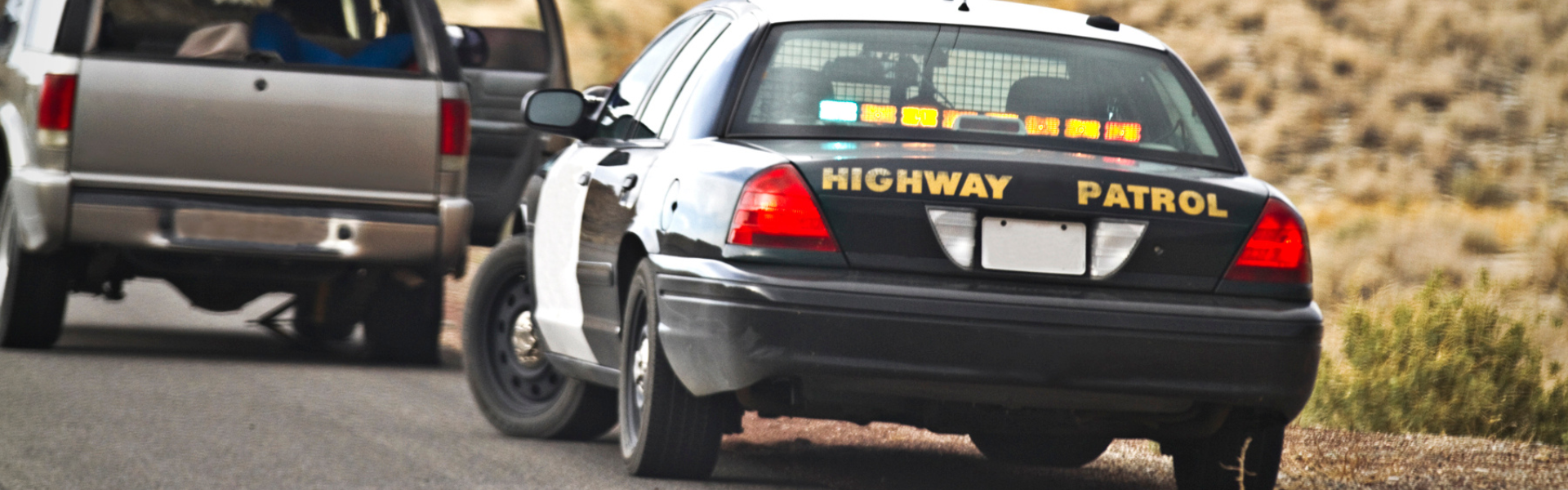 highway patrol vehicle pulling over suv
