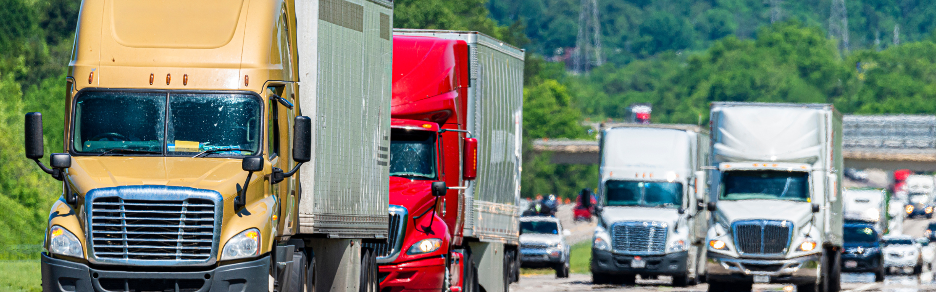 variety of semi trucks on busy interstate highway usa