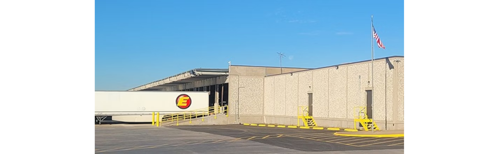 estes express terminal with estes express trailer backed up to the doc