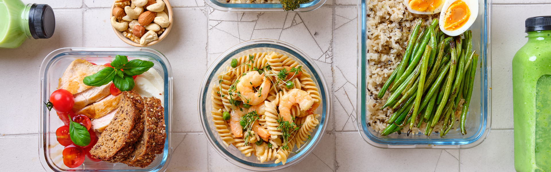 various meals spread out on a countertop in resealable containers