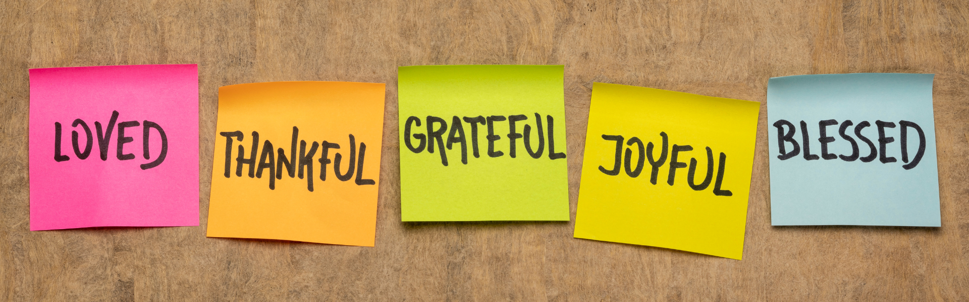 colorful post it notes with the words, loved, thankful, grateful, joyful, and blessed written on them