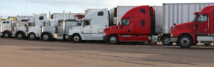 semi trucks parked at truck stop