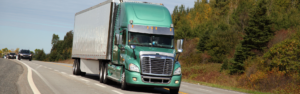 green semi truck with white trailer, atri survey on cargo theft