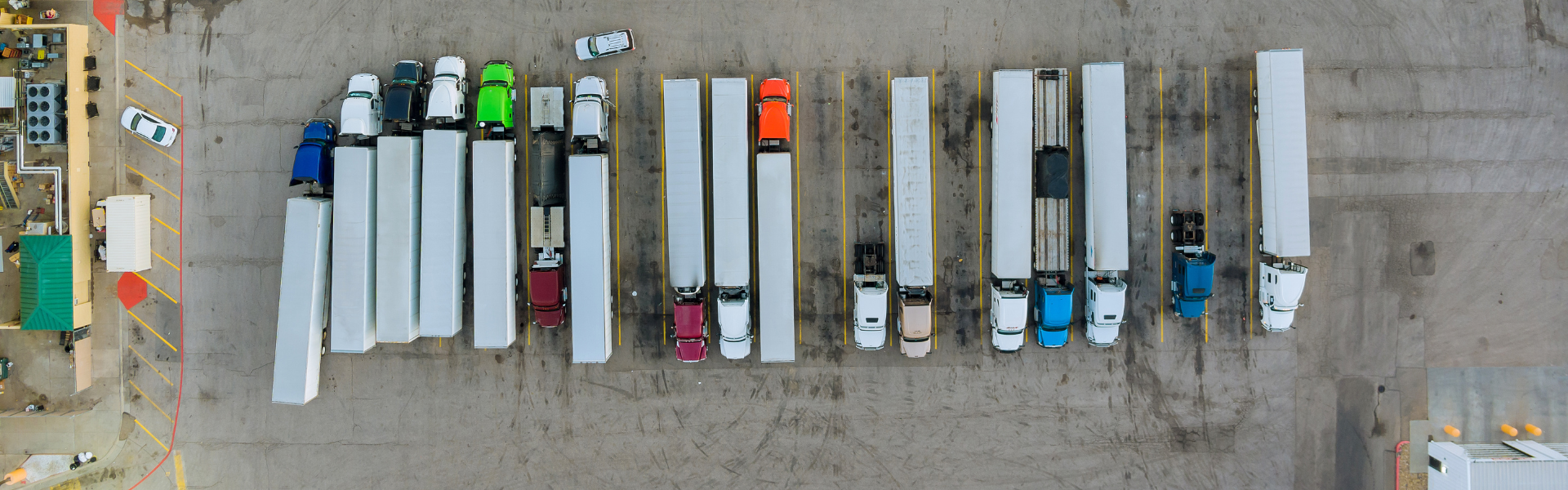 parked semi trucks in parking lot for semi trucks, truck parking