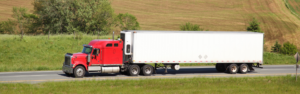 red semi truck on highway, fmcsa, grants, cdl training