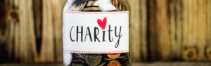 jar containing coins with a charity label on it