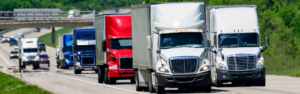 variety of semi trucks on interstate highway, trucker overtime pay