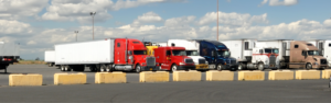 semi trucks parked in truck parking lot, expanded truck parking coming to oklahoma and maryland with TravelCenters of America