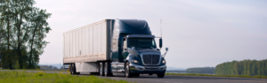 semi truck parked on side road with trees in background, cargo theft, cargo theft prevention, security, safety and security