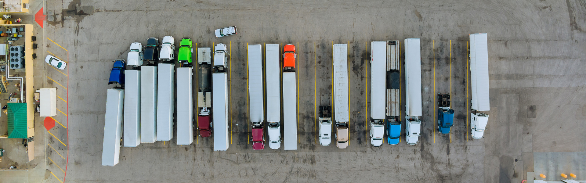 parked semi trucks in semi truck parking lot : The federal government is investing $4.2 billion in infrastructure, creating 260 new truck parking spaces through grants from the Bipartisan Infrastructure Law.