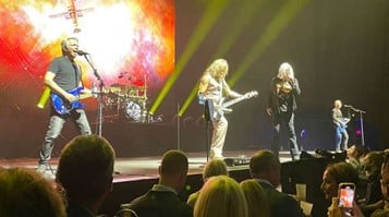 Image of Def Leppard performing on stage at the 2024 Daimler Truck Customer Appreciation Event.