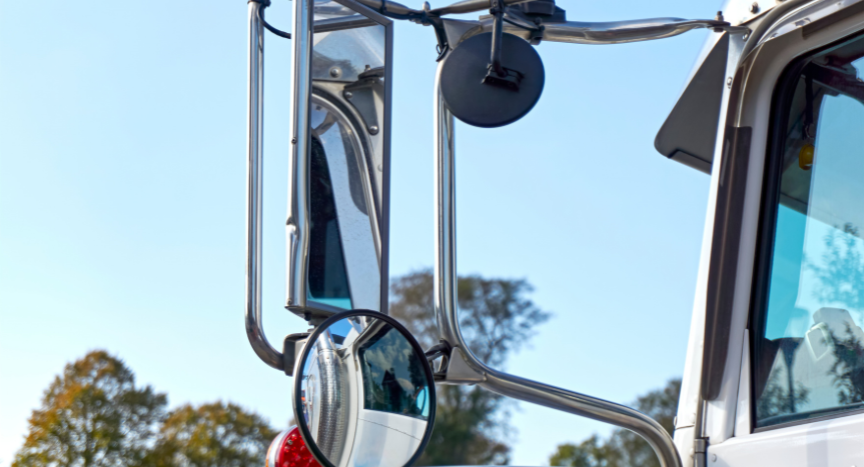 Learn how semi-truck blind spots change during everyday driving, why mirror setup matters, and the techniques professional drivers use to maintain better visibility.