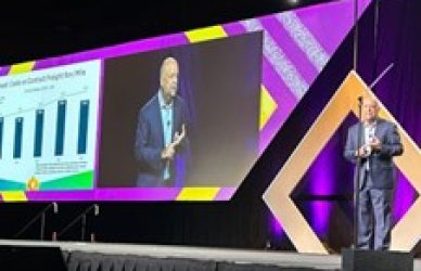 Chief Economist of the American Trucking Associations Bob Costello on stage at the ATA Management Conference sharing insights on the trucking industry's recovery.