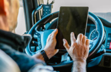 truck driver looking at tablet