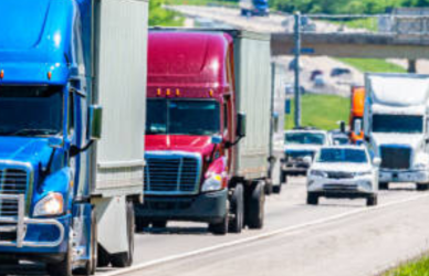 semi cars and passenger vehicles on highway