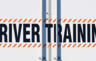 semi truck with driver training printed on the back