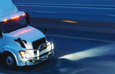semi truck on road at night