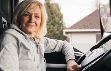 woman in cab of semi truck