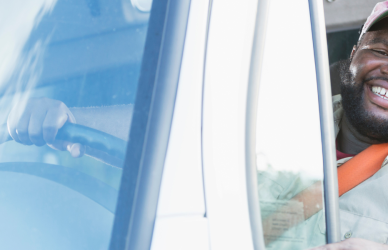 black man driving semi truck