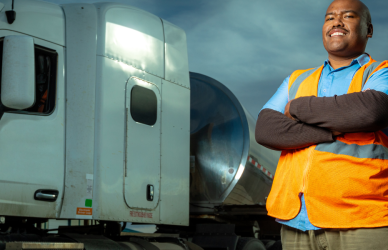 man standing in front of semi truck