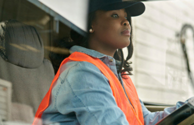 black woman driving semi truck