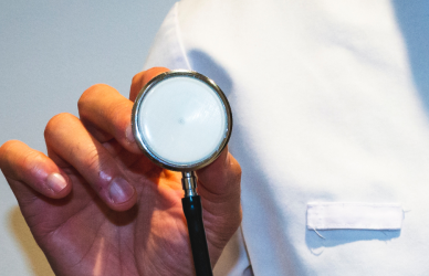 doctor holding up stethoscope