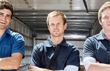 three blue collar men