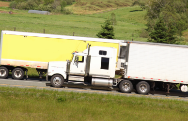 two semi trucks on road