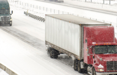 Semi trucks on snowy highway