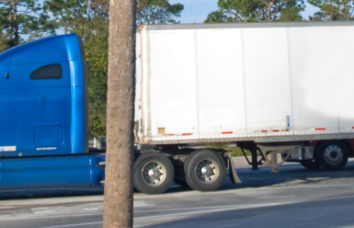 blue semi truck with trailer