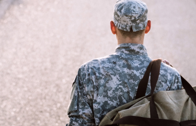 Veteran standing on road