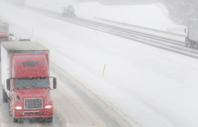 snowy interstate highway with semi trucks